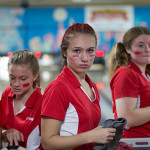 A group of girls in red uniform for bowling