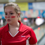 A girl wearing red bowling uniform